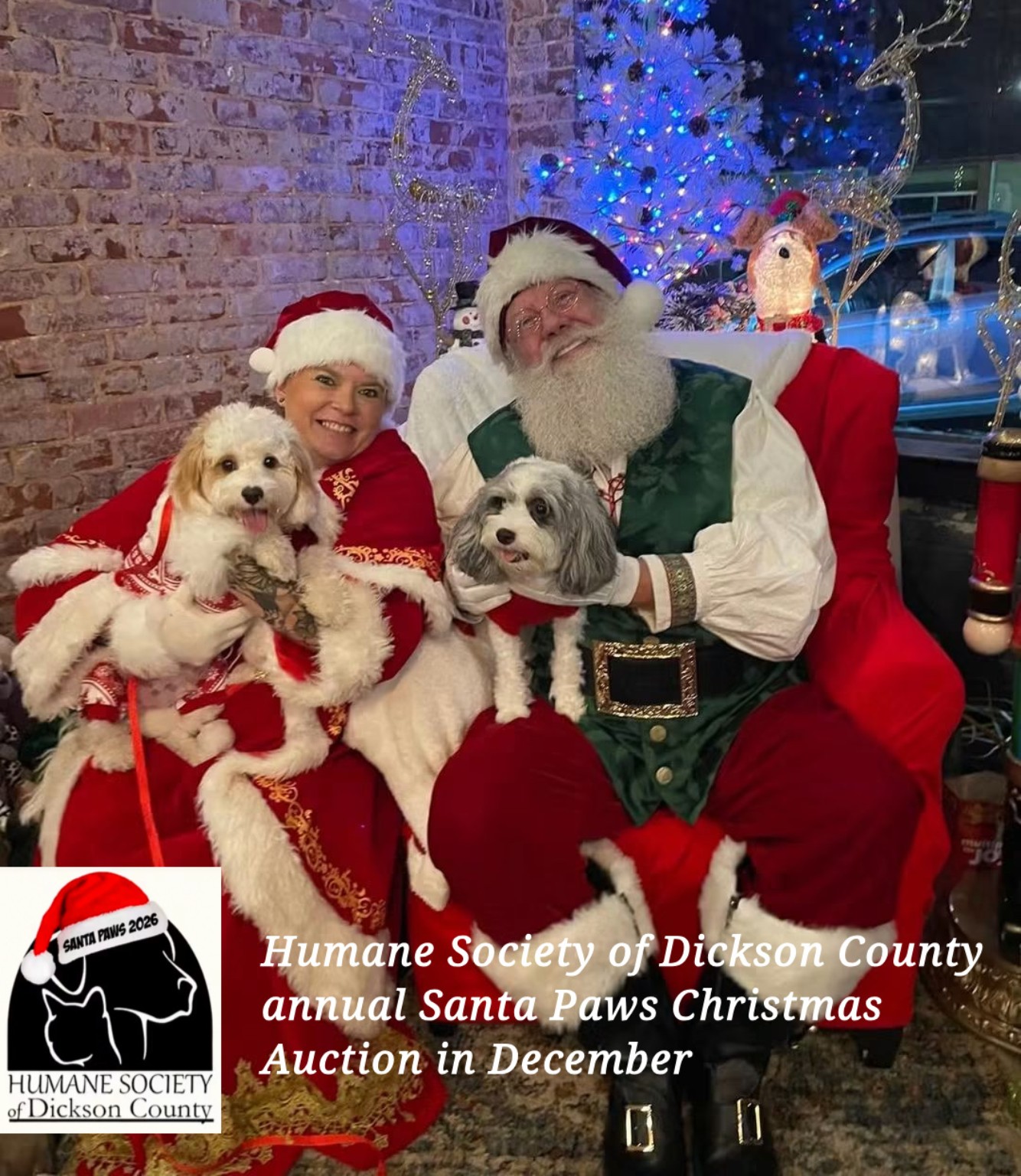 Santa Arthur and Mrs. Claus with two dogs at the Humane Society of Dickson County annual Santa Paws Christmas Auction